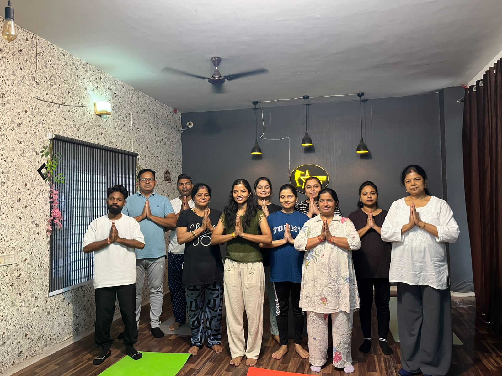 Yoga instructor guiding class